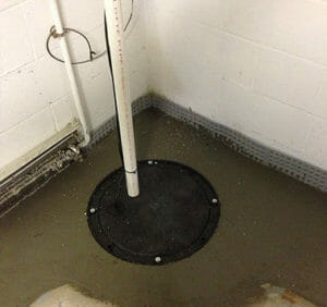 Installing a sump pump and waterproofing system